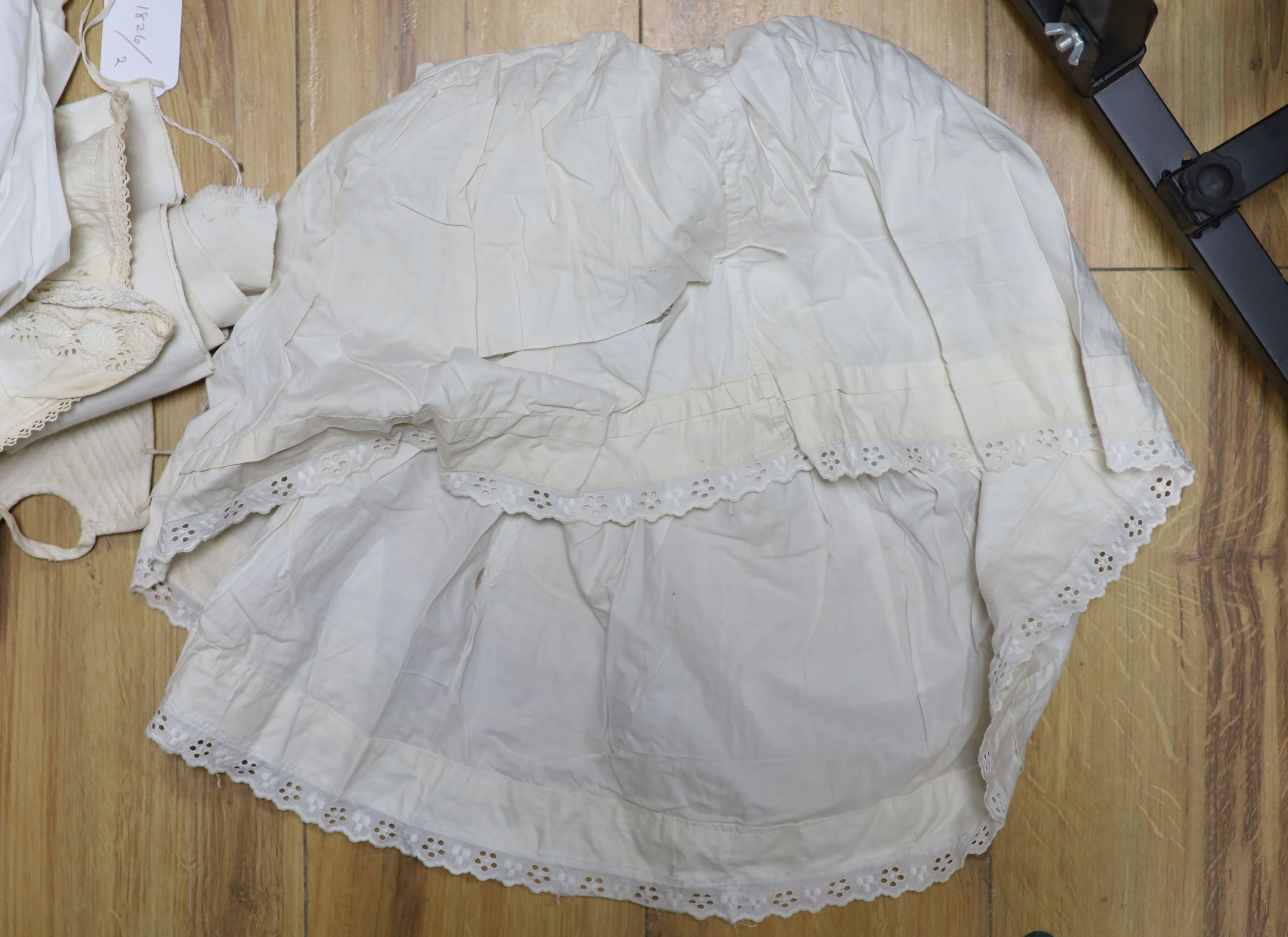 A collection of christening gowns and baby dresses
